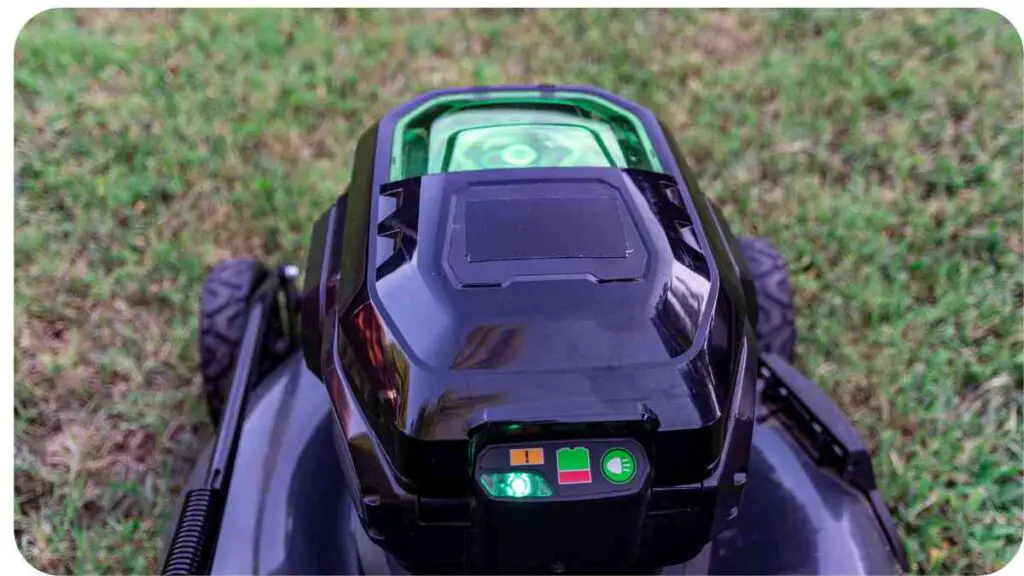 an electric lawn mower with a green light on it