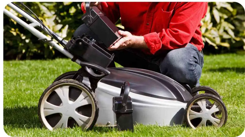 a person is using a lawn mower to cut the grass