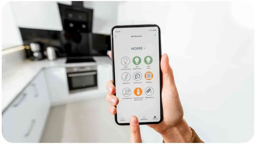 a person holding up a smart phone in front of a kitchen