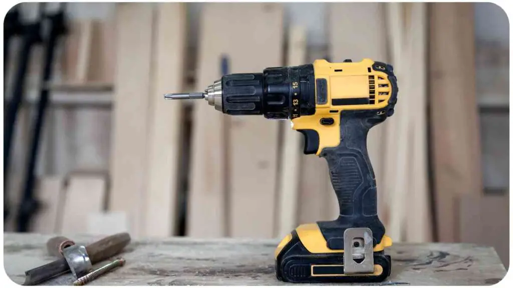 a yellow and black cordless drill is sitting on top of a wooden table