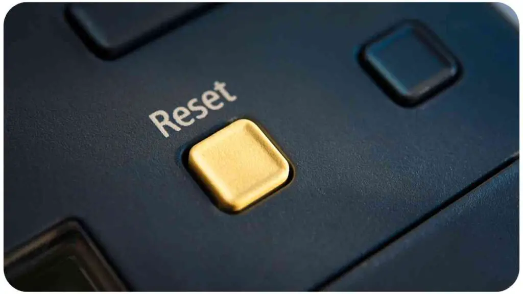a close up of the reset button on a computer