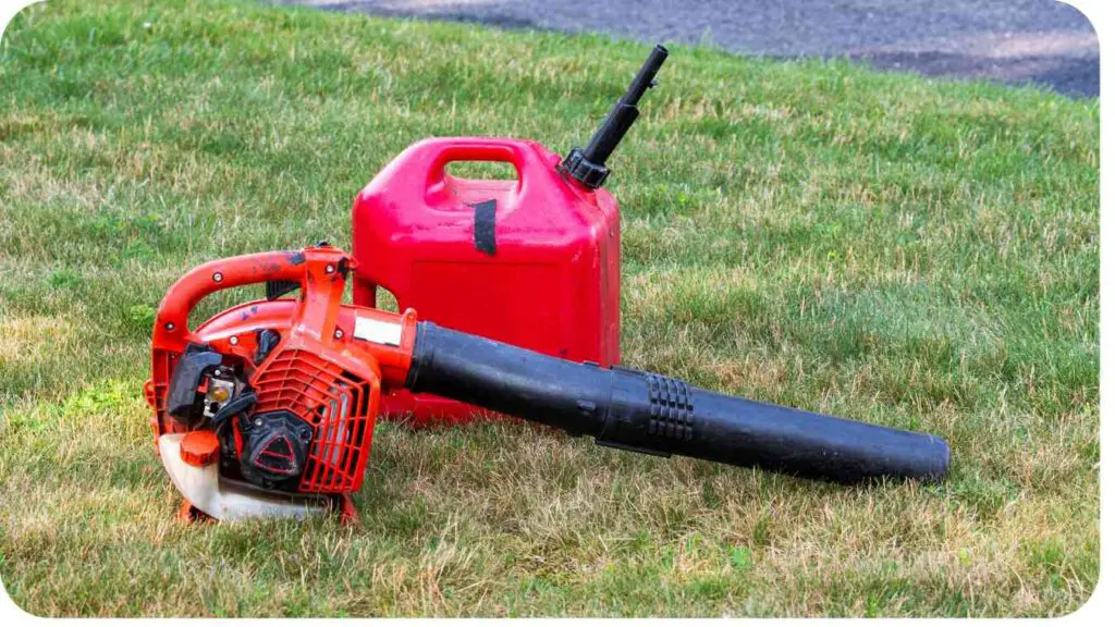 a gas can and a leaf blower sitting on the grass