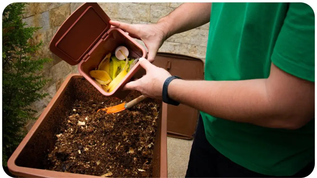 a person in a green shirt is holding a brown container with soil in it