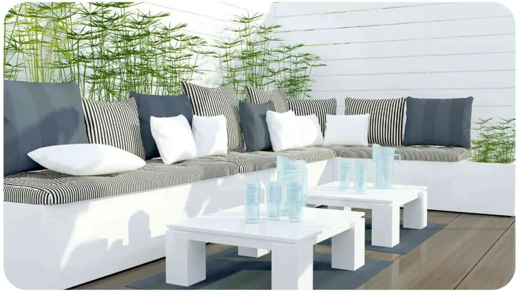 an outdoor patio with white furniture and plants