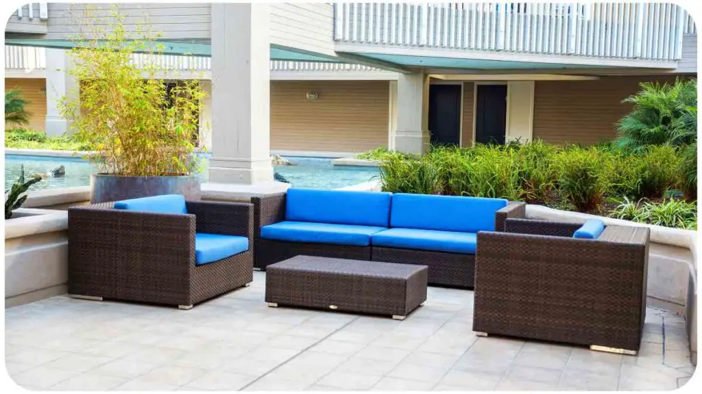 an outdoor patio furniture set with blue cushions