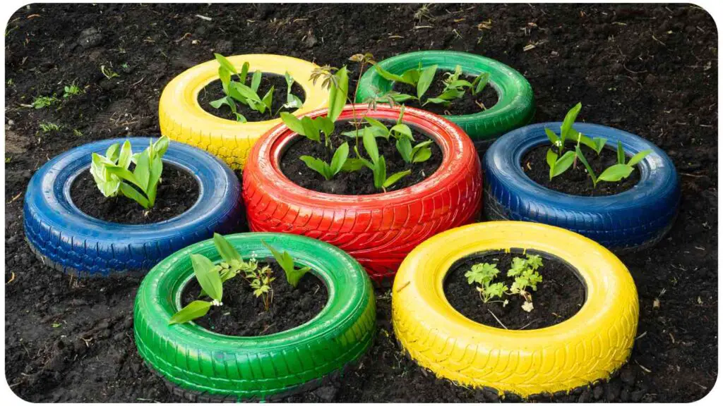 a group of colorful tires with plants in them