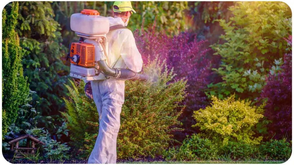 a person with a backpack and a sprayer in the garden