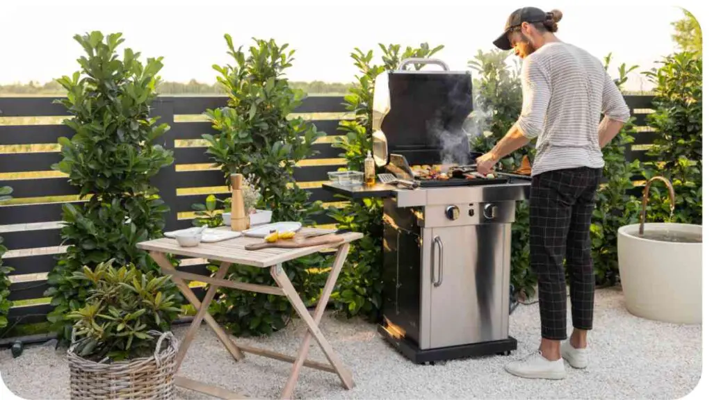 A person is cooking on an outdoor grill.