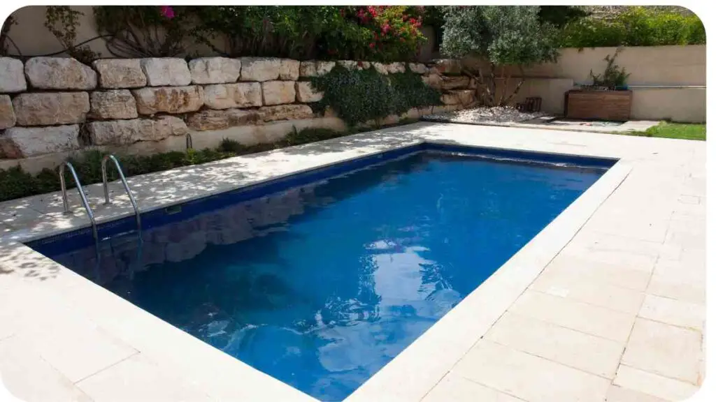 a small rectangular swimming pool in a backyard